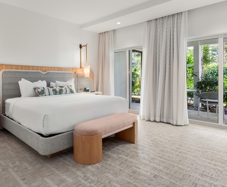 a bedroom with a bed and a bench
