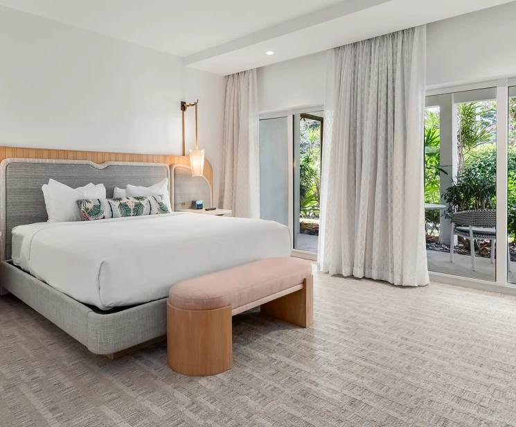 a bedroom with a bed and a bench