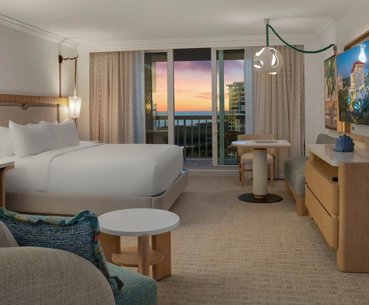 a hotel room with a bed and a table