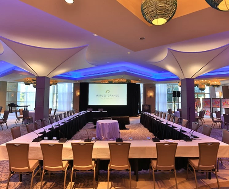a room with a large table and chairs