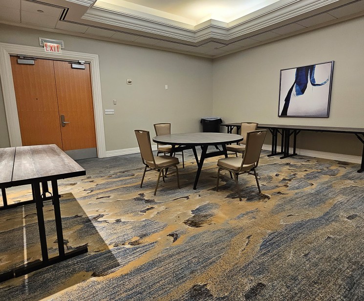 a room with a table and chairs