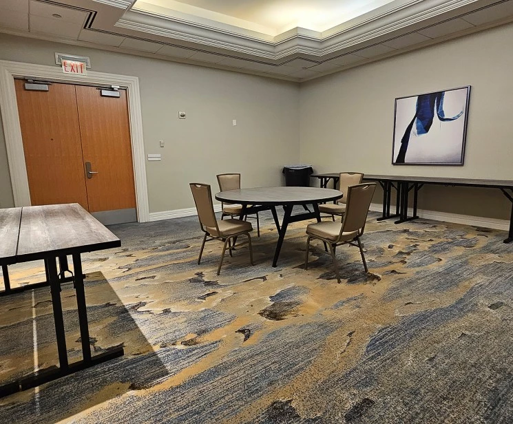 a room with a table and chairs