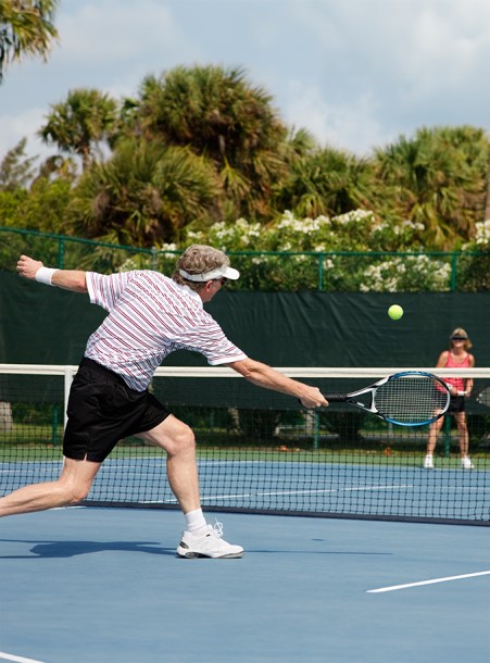 a man swinging a tennis racket
