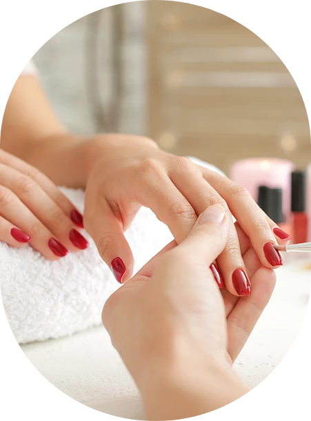a close-up of a woman receiving a manicure