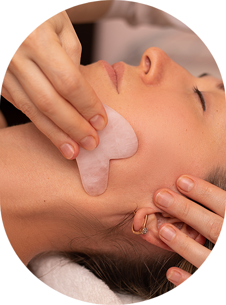 a woman receiving a face massage