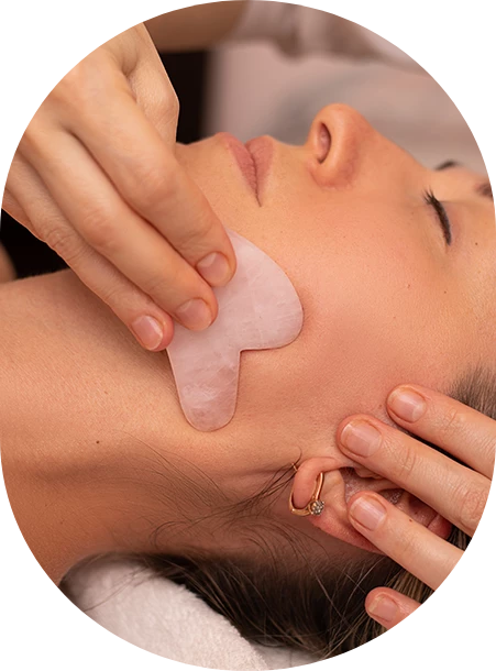 a woman receiving a face massage