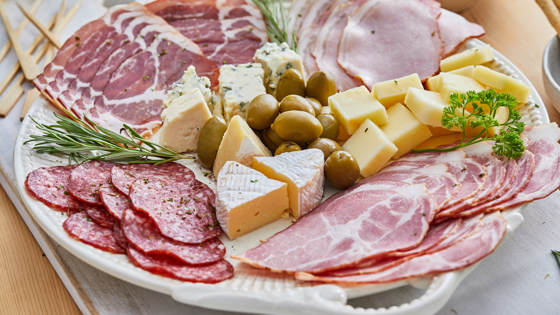 a plate of meat and cheese