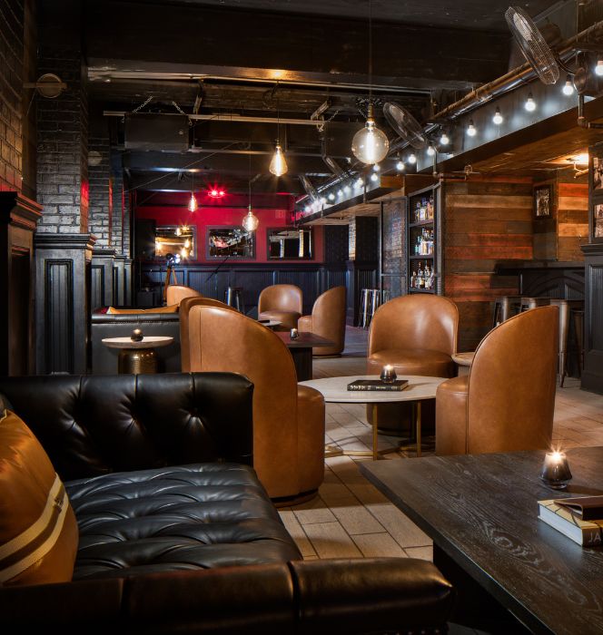 a room with leather chairs and tables