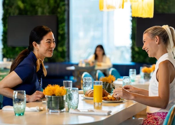 a group of women sitting at a table