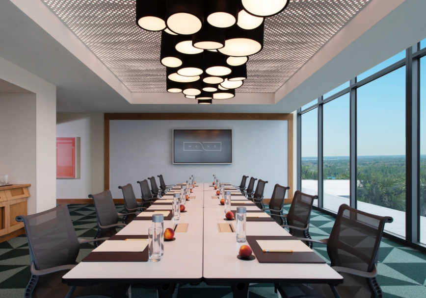 a long conference room with chairs and tables
