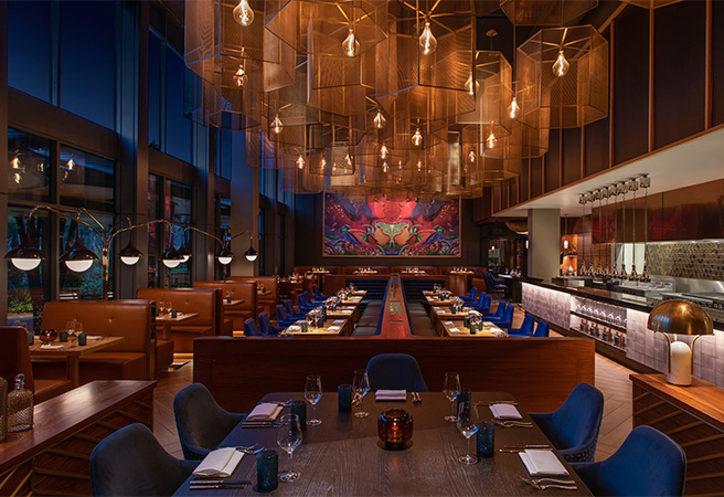 a restaurant with chandeliers and tables 