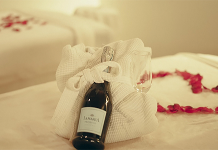 a bottle of wine and a glass