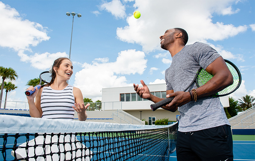 a man and woman playing tennis