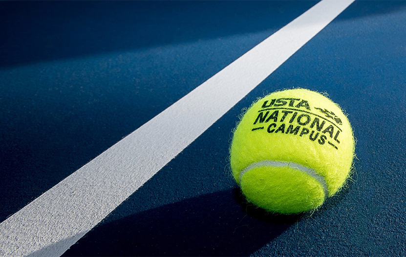 a tennis ball on a blue court