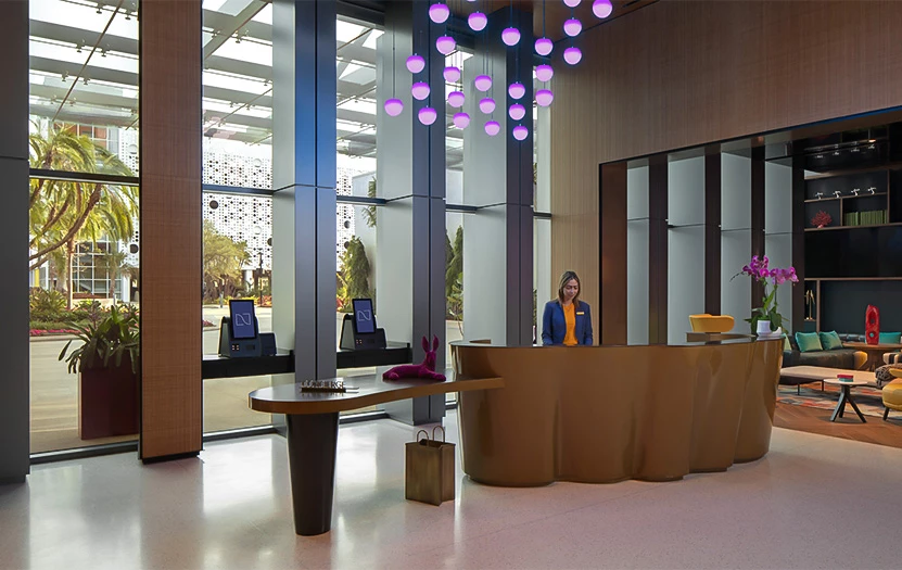 a woman standing at a reception desk