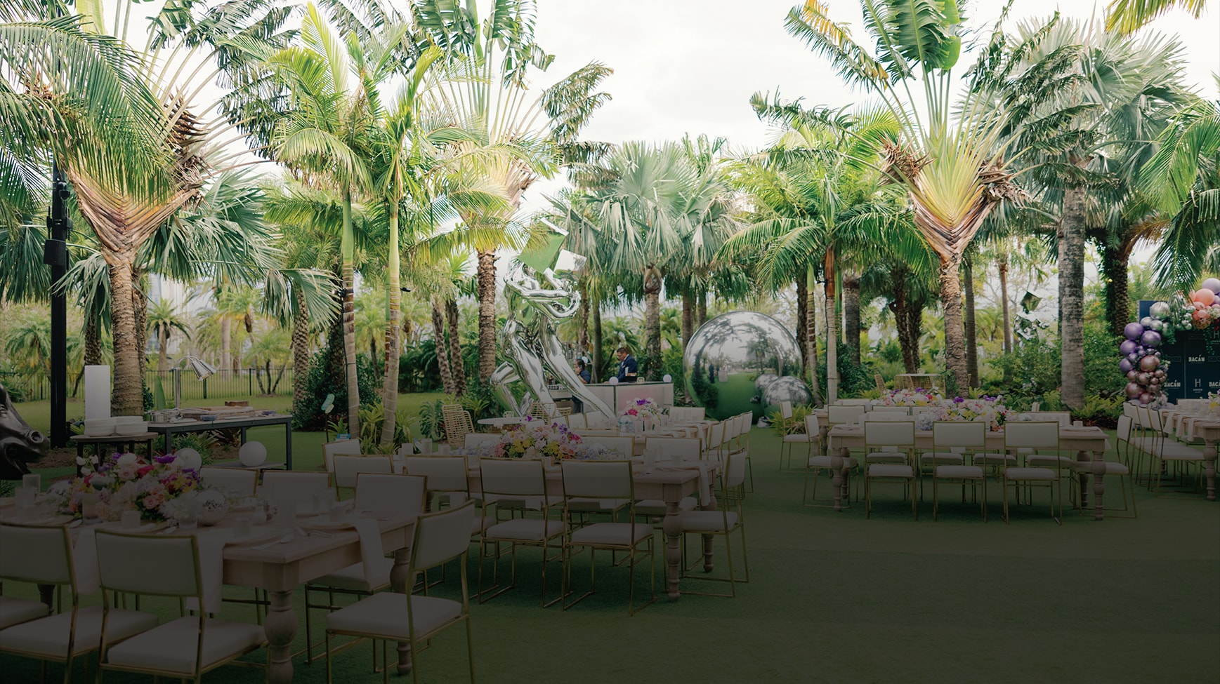 a group of tables and chairs in a garden