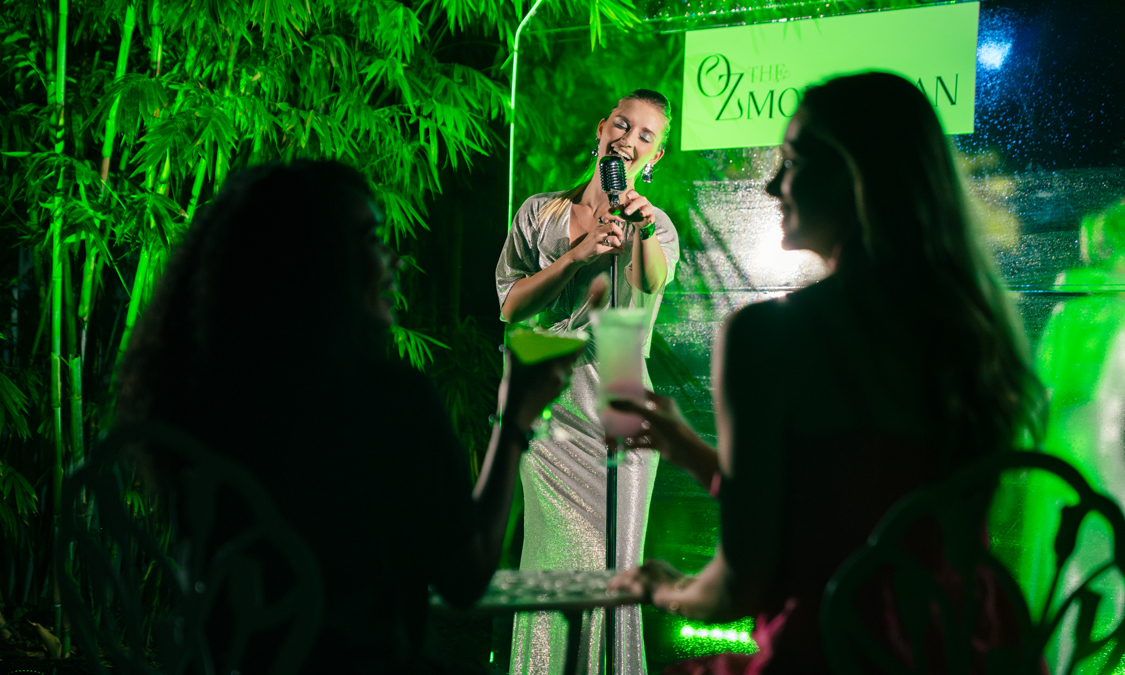 a woman singing into a microphone