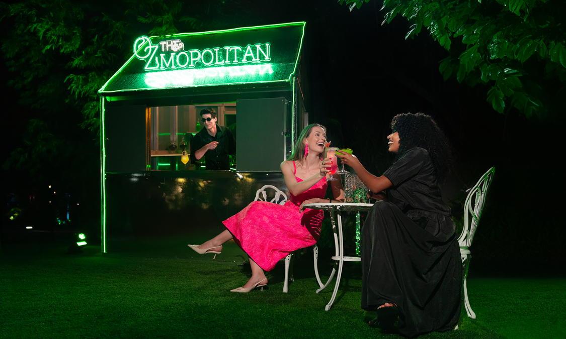 a group of women sitting at a table with drinks