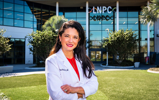 a woman in a white coat