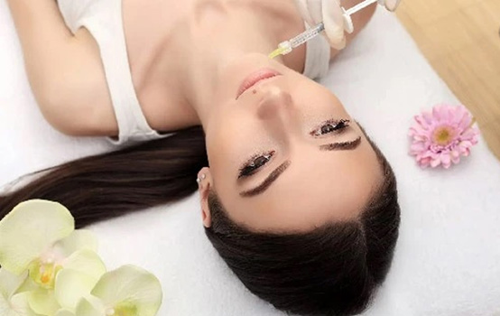a woman getting a botox injection