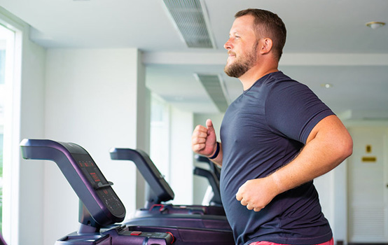 a man running on a treadmill
