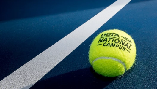 a tennis ball on a blue surface