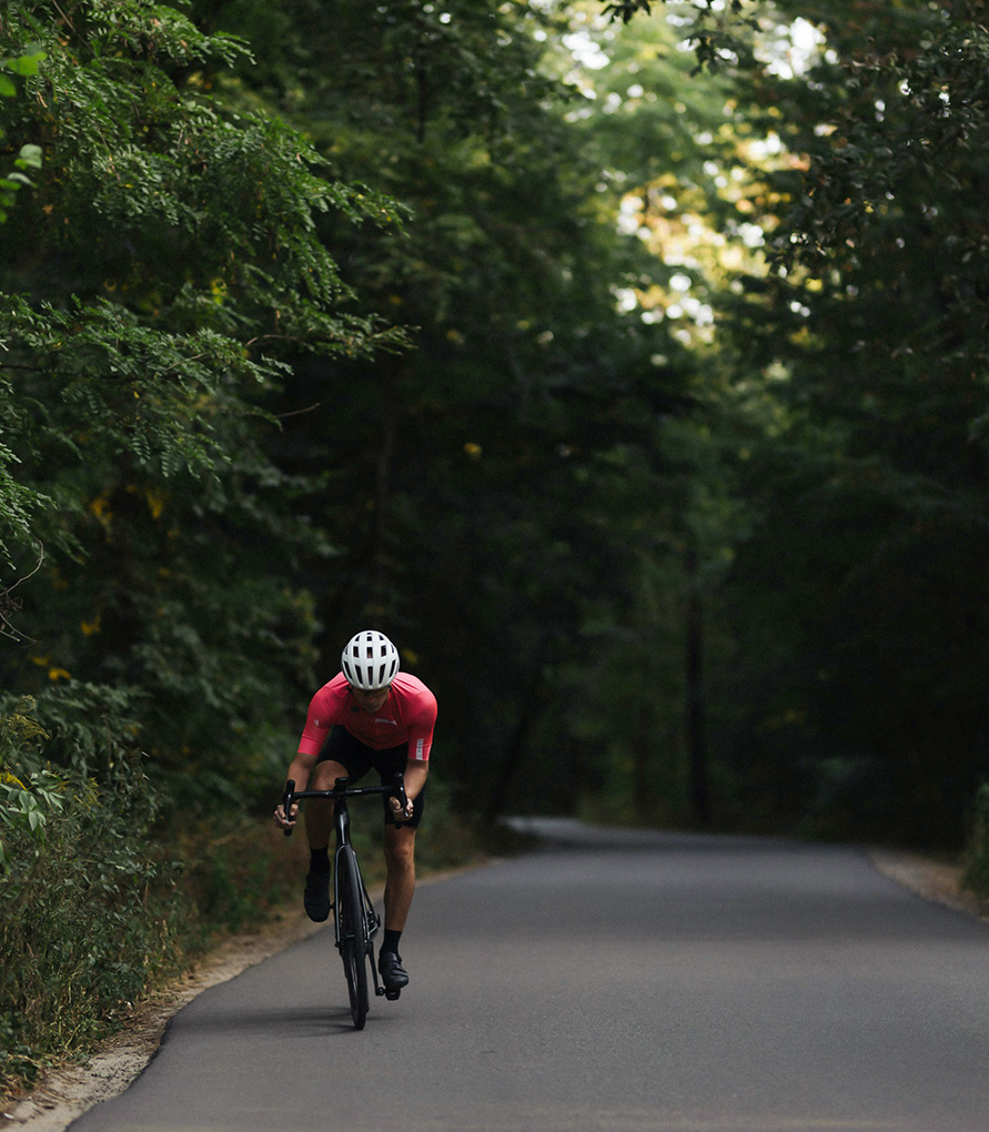 a man riding a bike on a road
