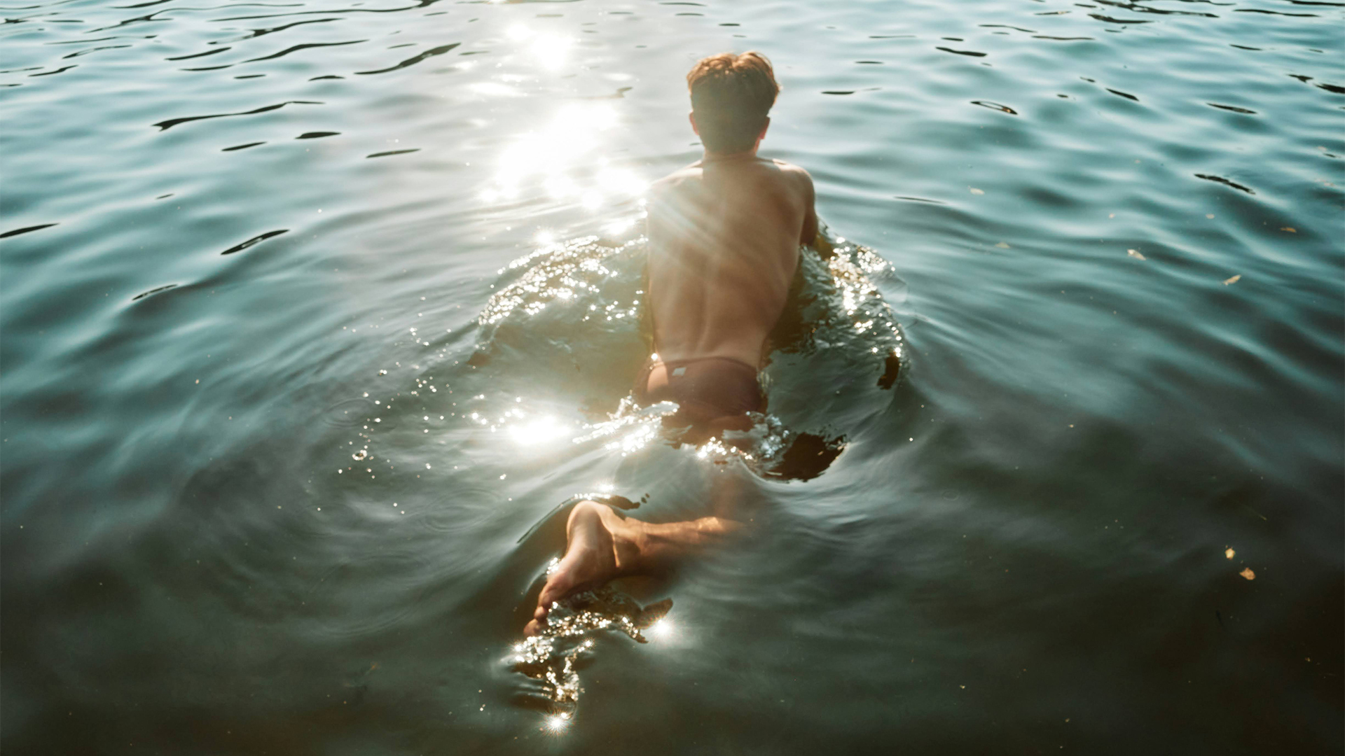 a man swimming in water