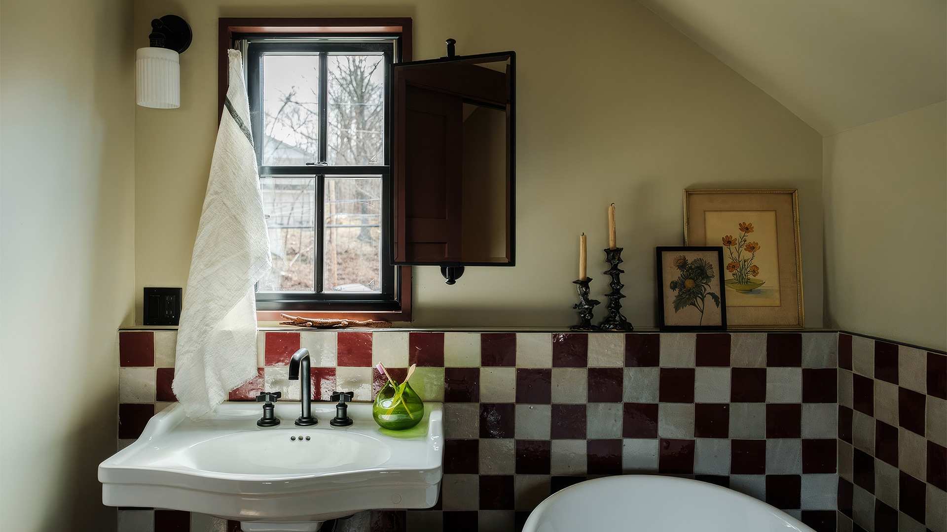 a bathroom with a sink and a window