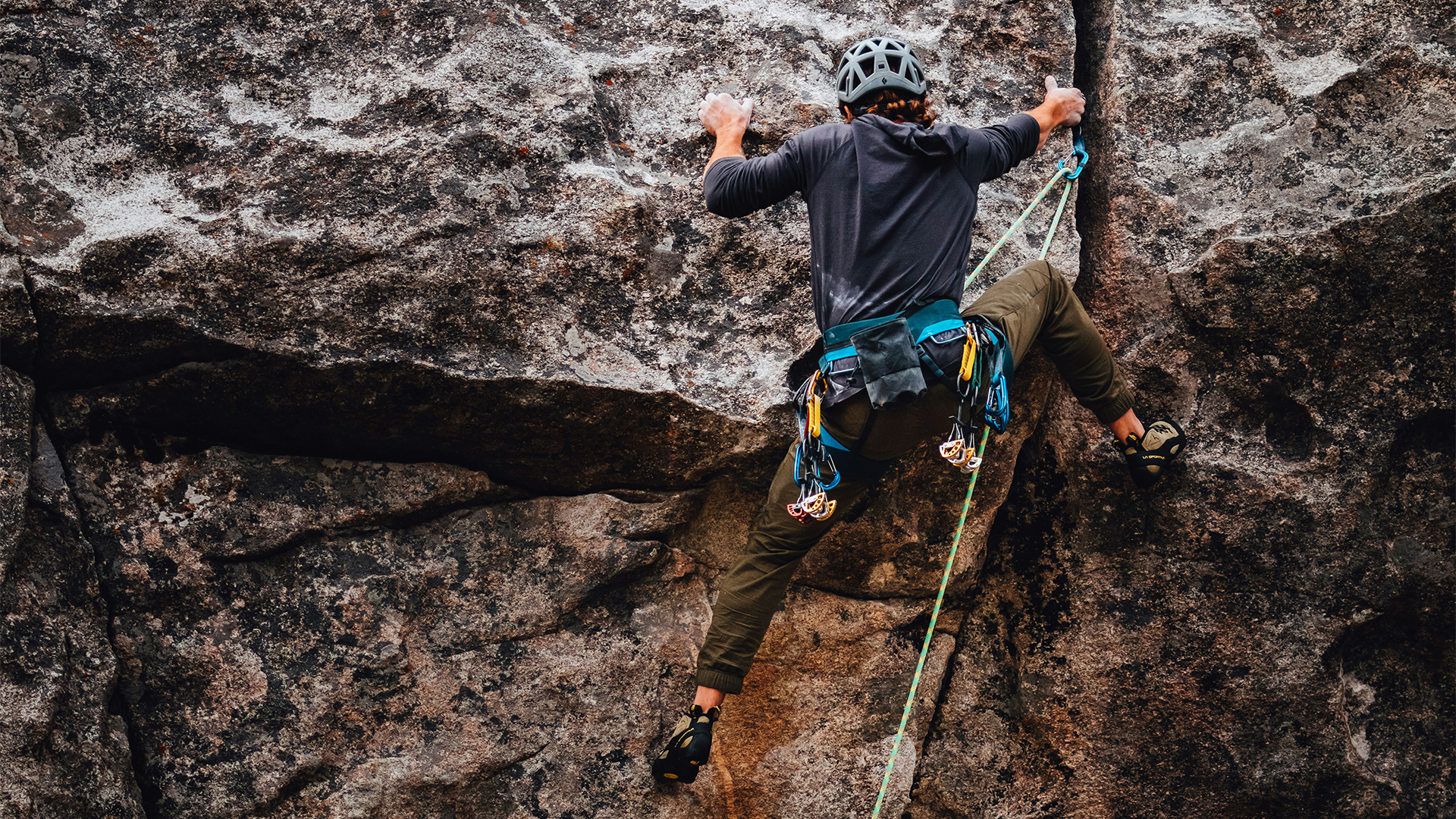 a person climbing a rock