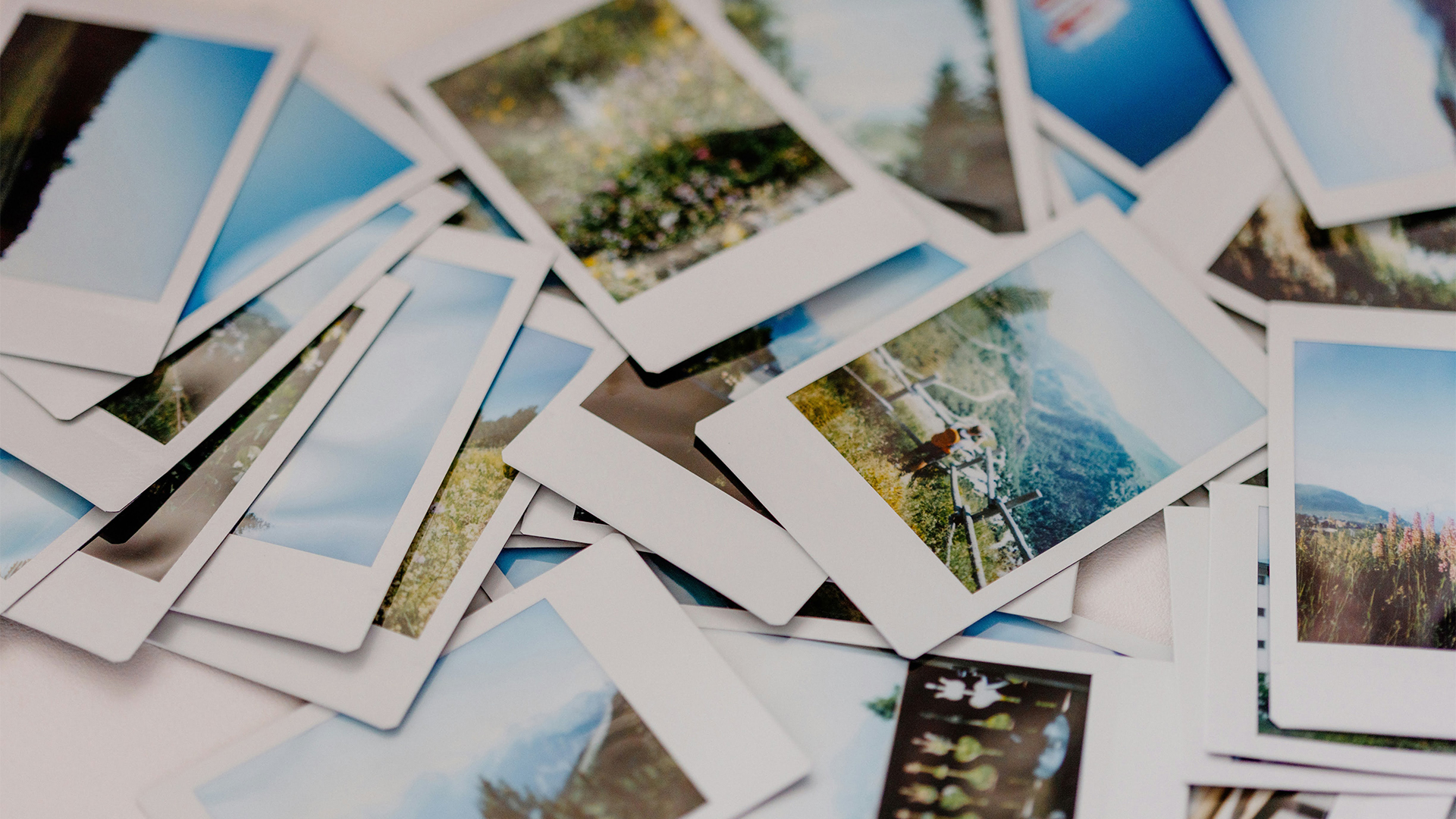 a pile of polaroid photos