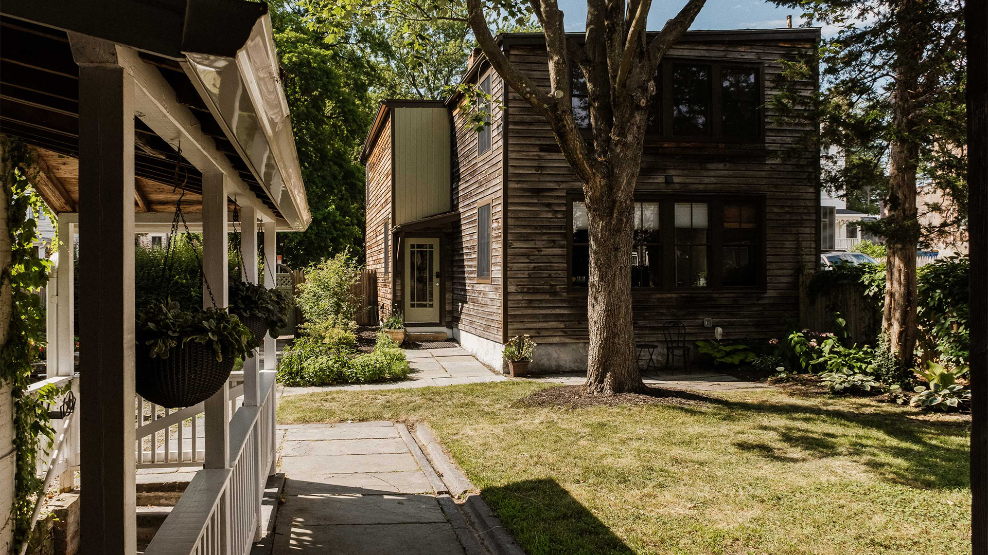 a house with a tree in the back yard