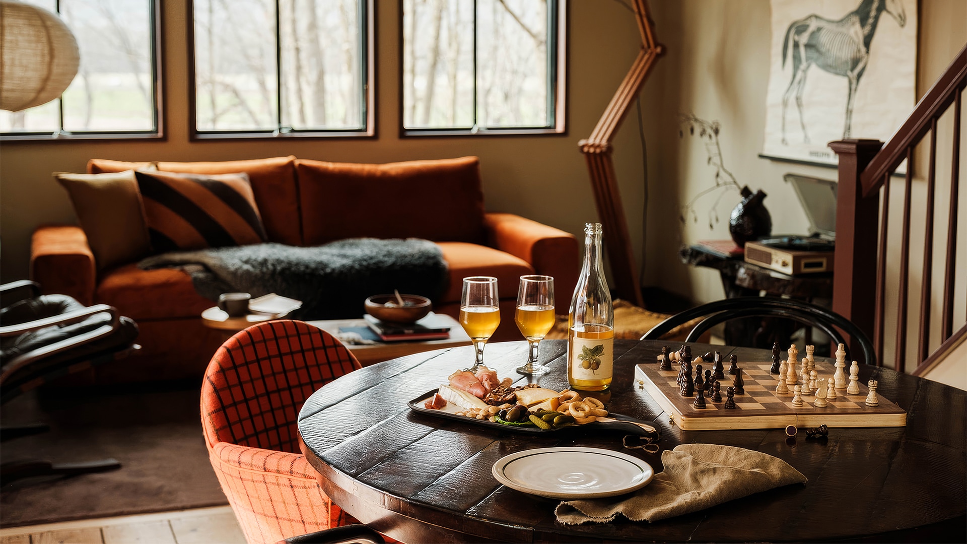 a table with food and wine glasses on it