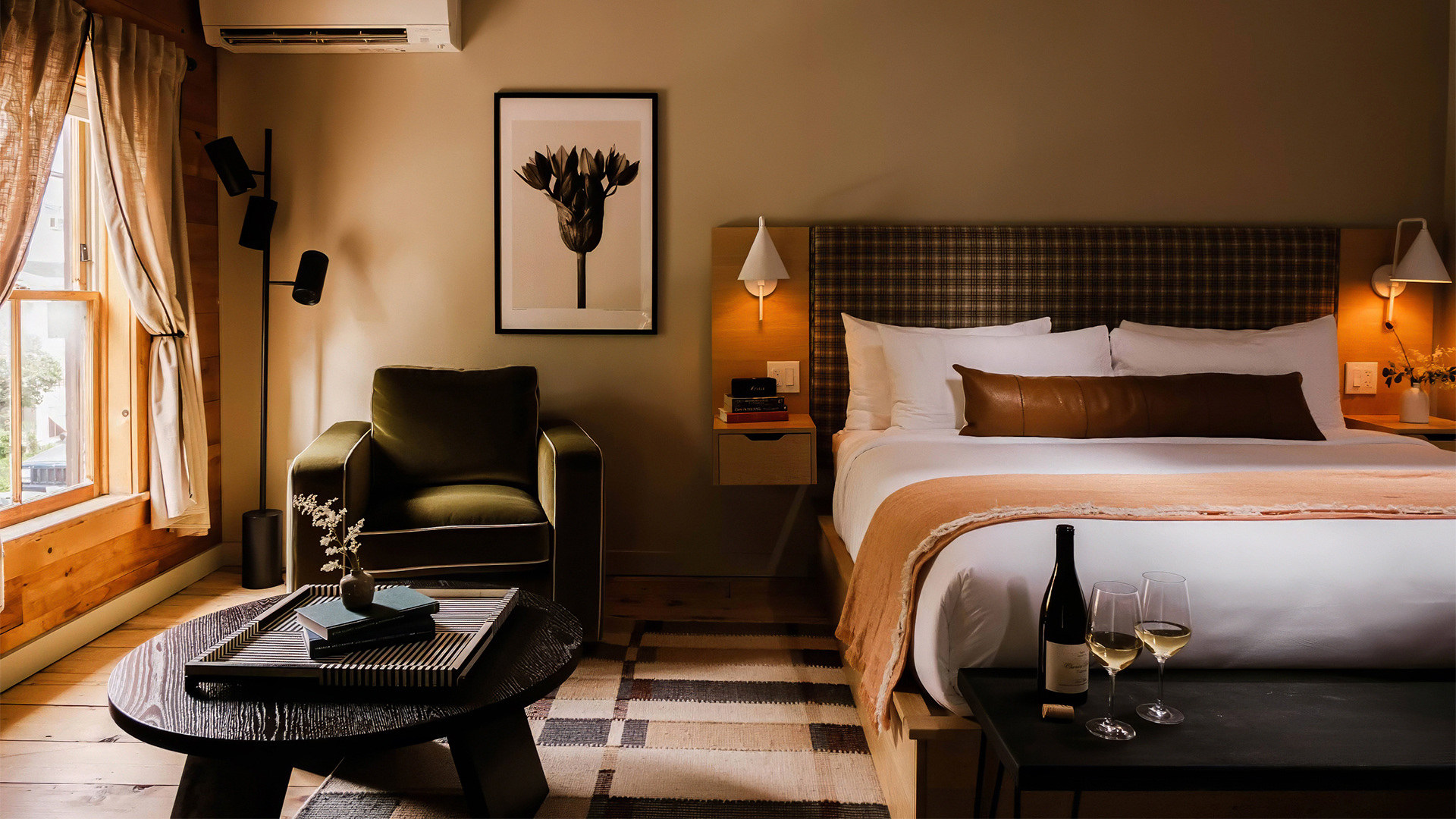 a room with a bed and a chair