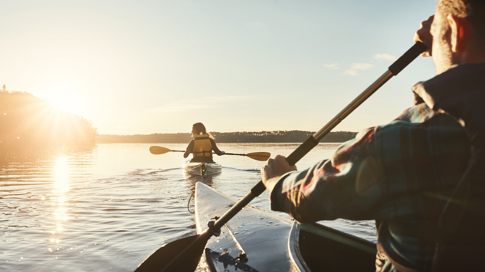 a person in a kayak on a lake