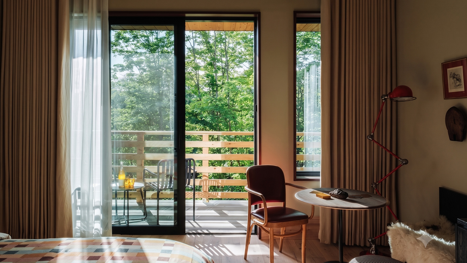 a room with a table and chairs and a sliding glass door