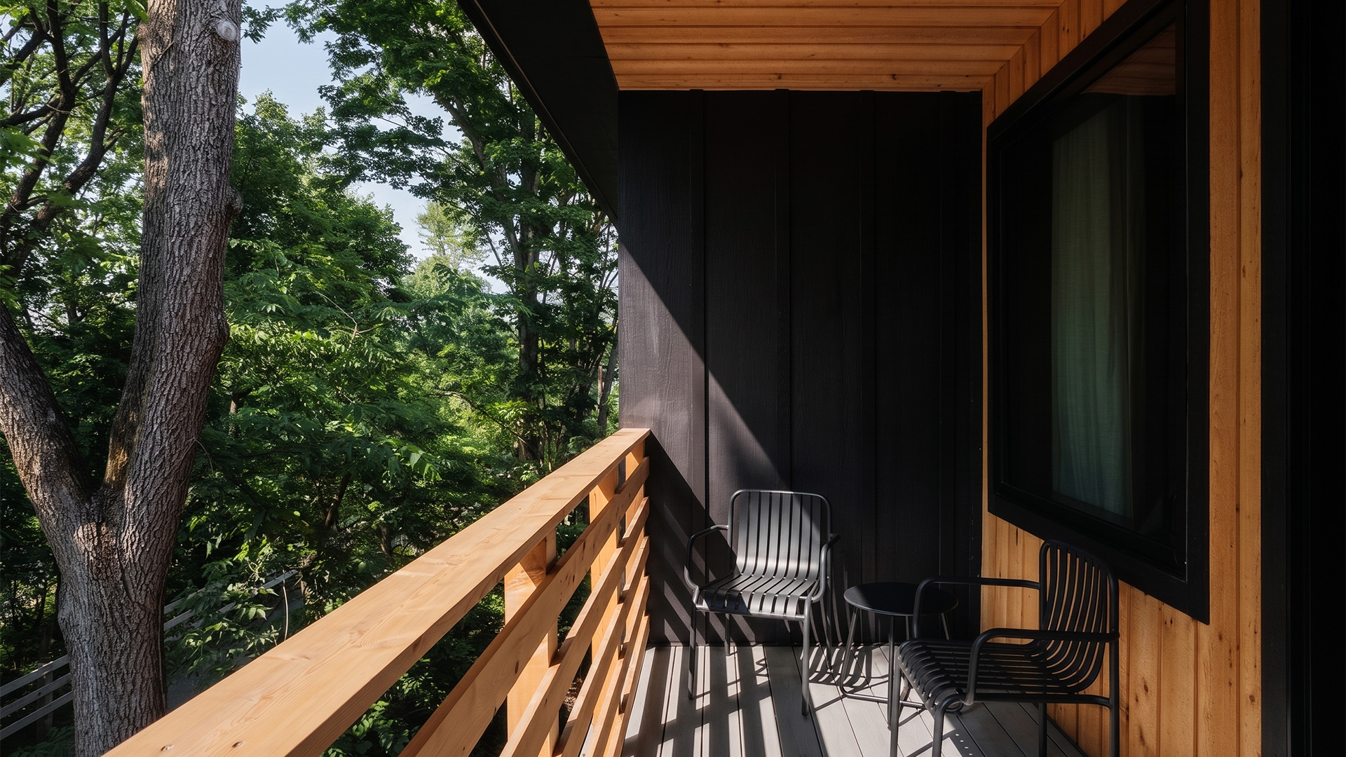 a deck with chairs and a tv on it