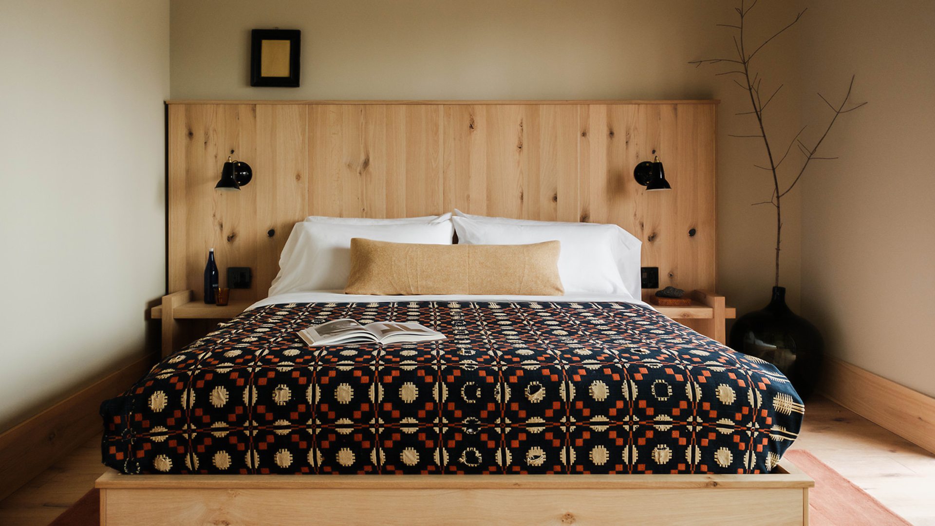 a bed with a book on it