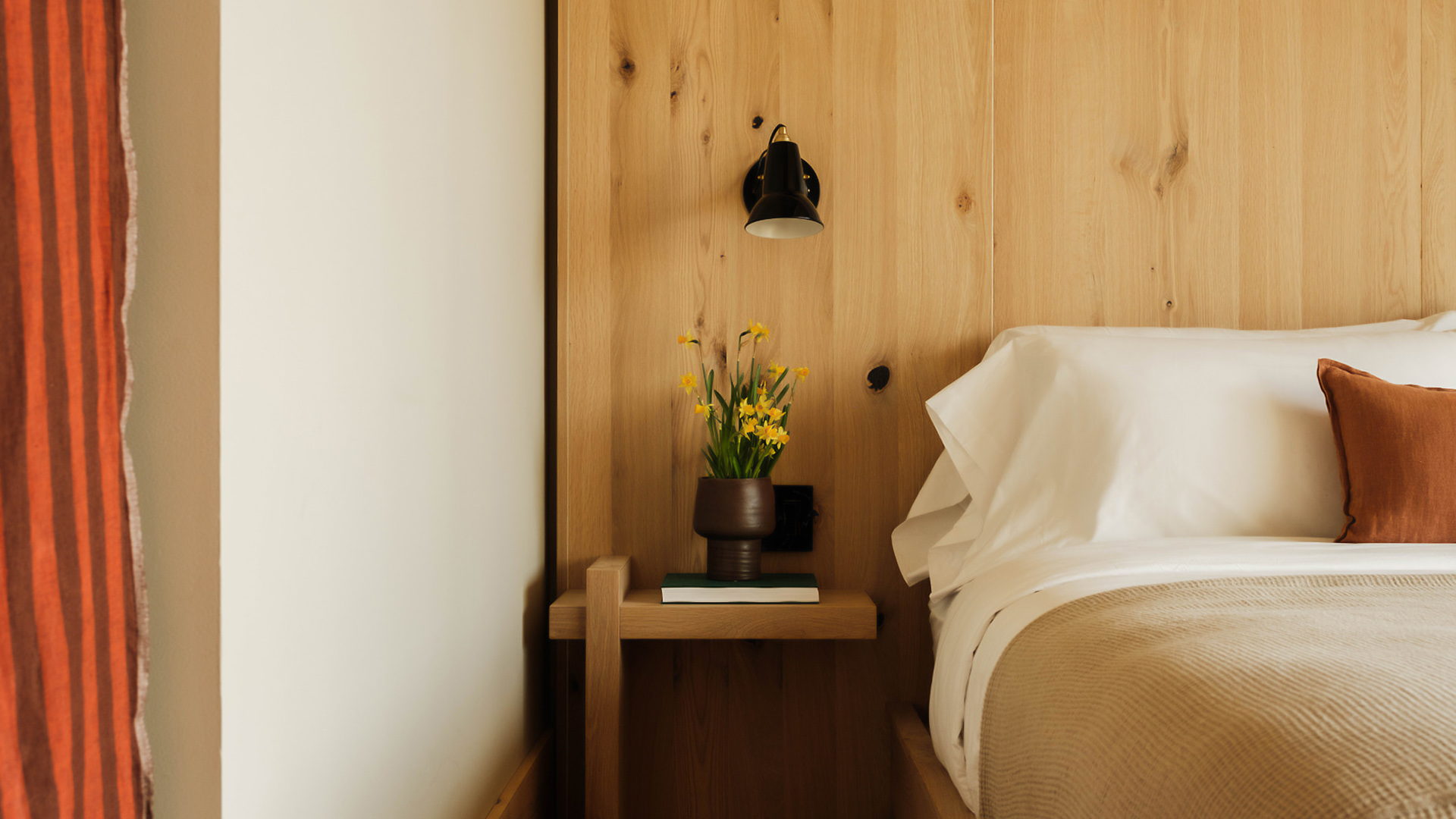 a table next to a bed
