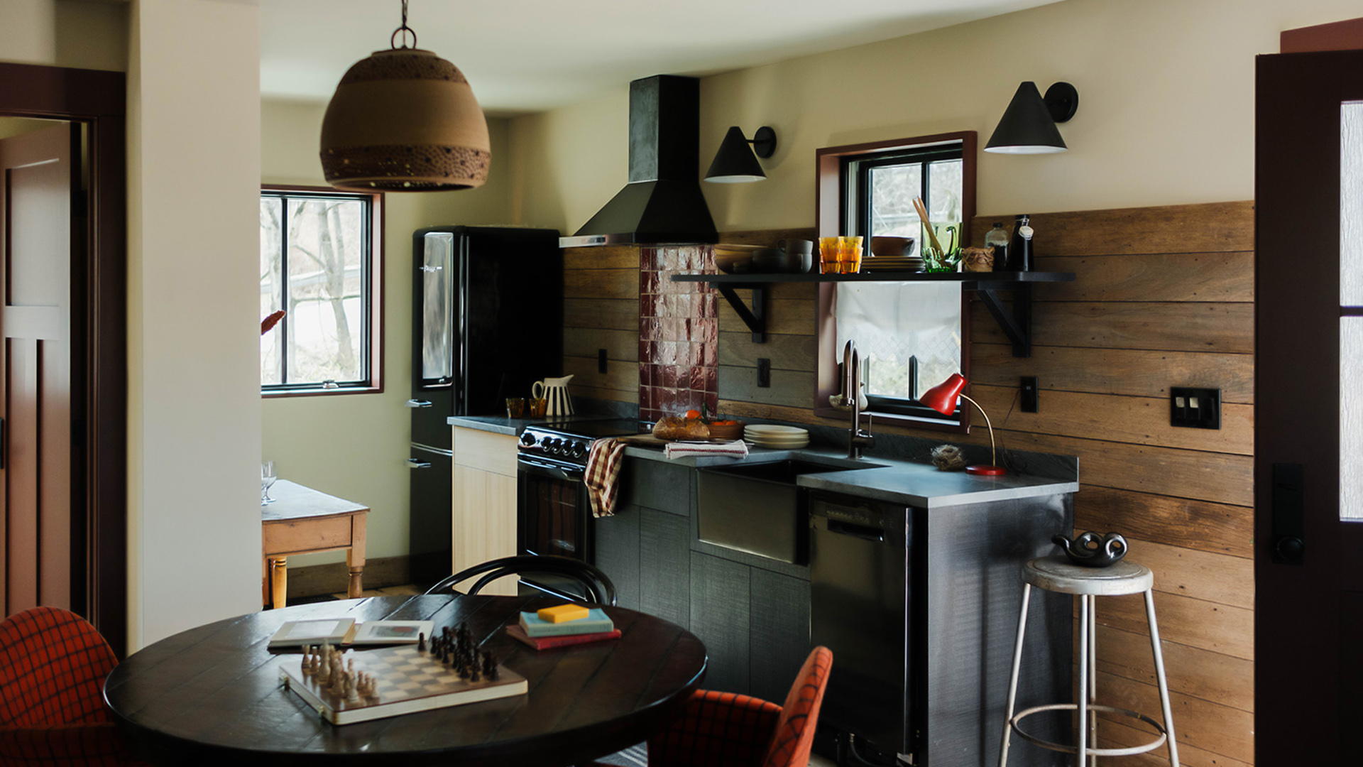 a kitchen with a table and chairs