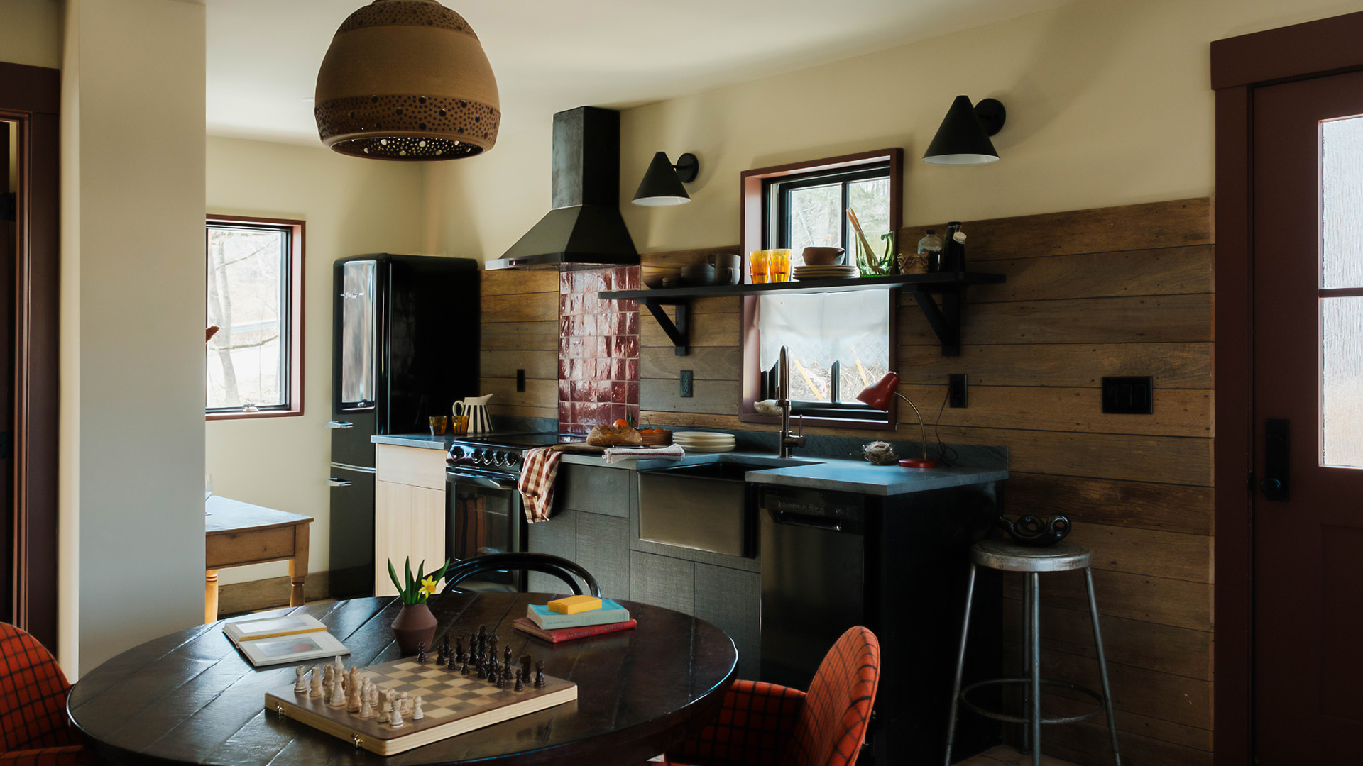 a kitchen with a table and chairs