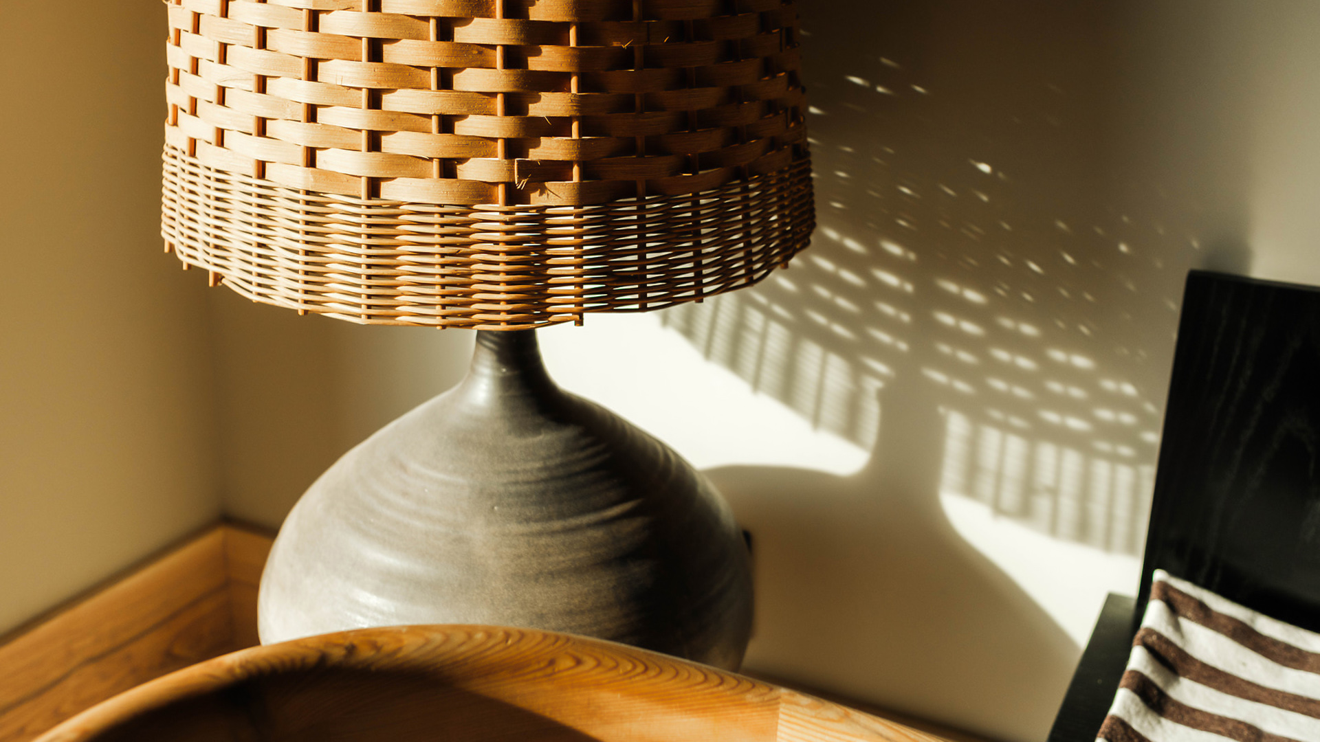 a lamp with a basket shade