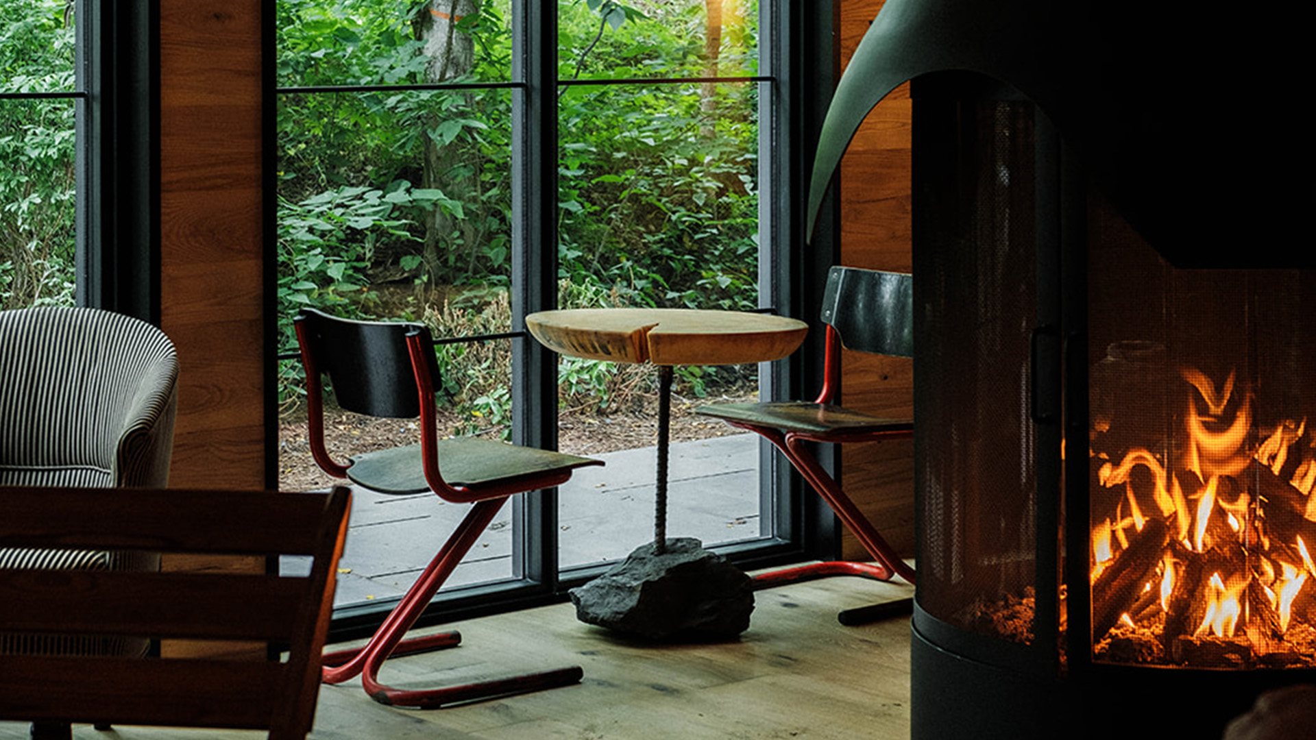 a table and chairs in a room with a fireplace