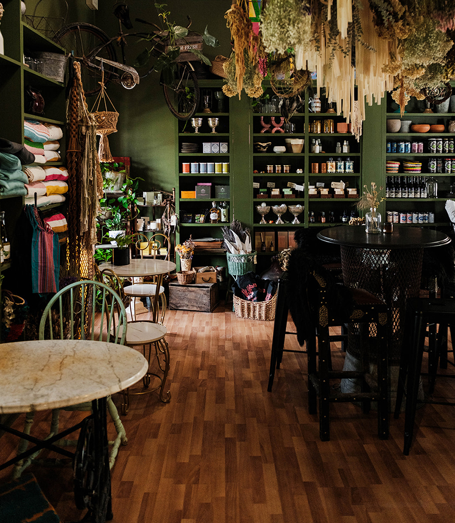a room with shelves and tables