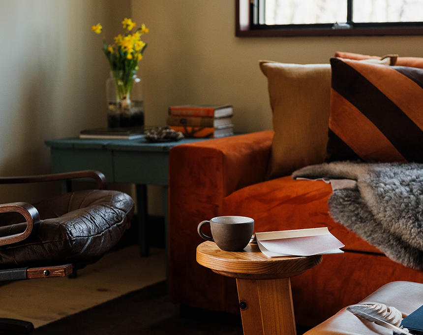 a coffee cup on a table in a living room