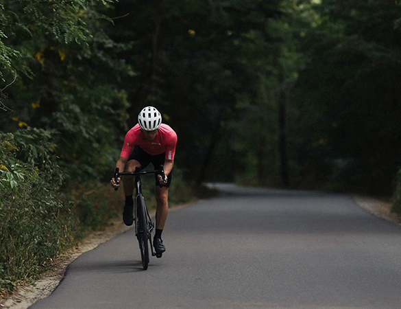 a man riding a bike on a road