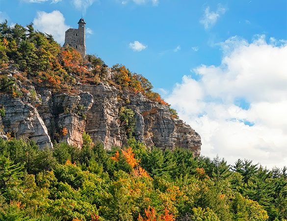 a stone building on a cliff