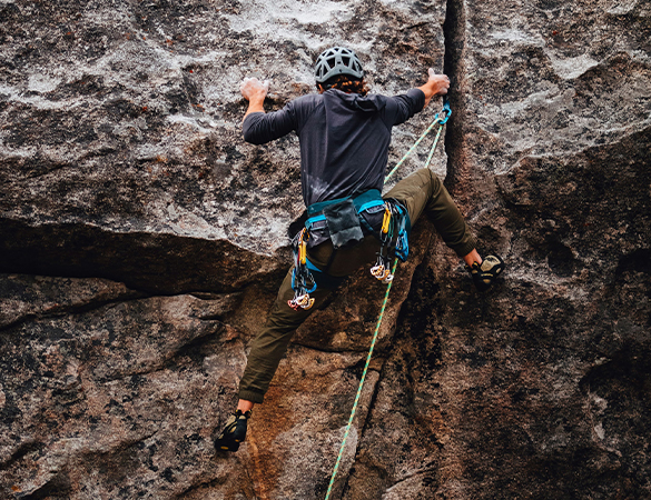 a person climbing a rock