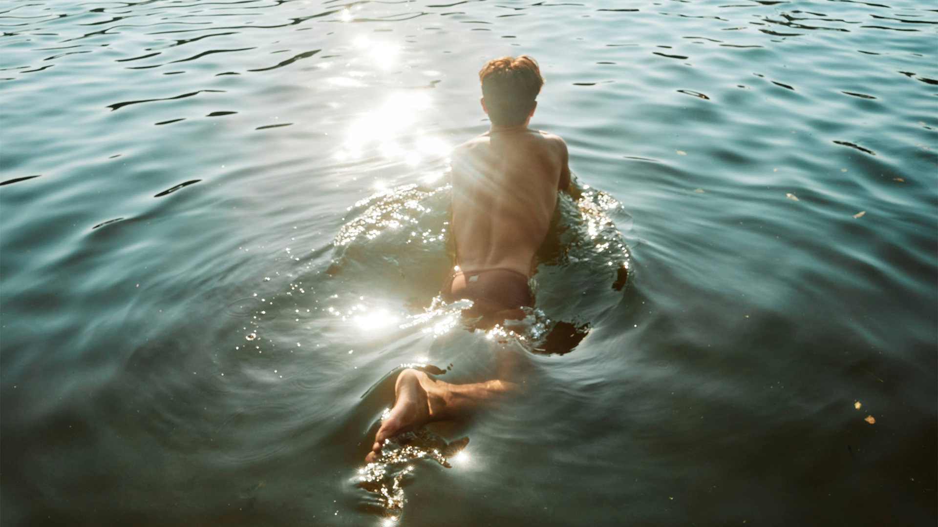 a man swimming in water