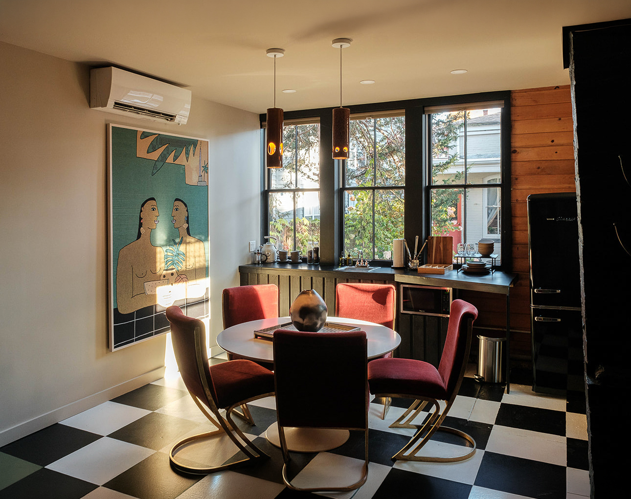 a room with a table and chairs